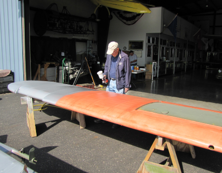 Applying primer to the airframe prior to covering